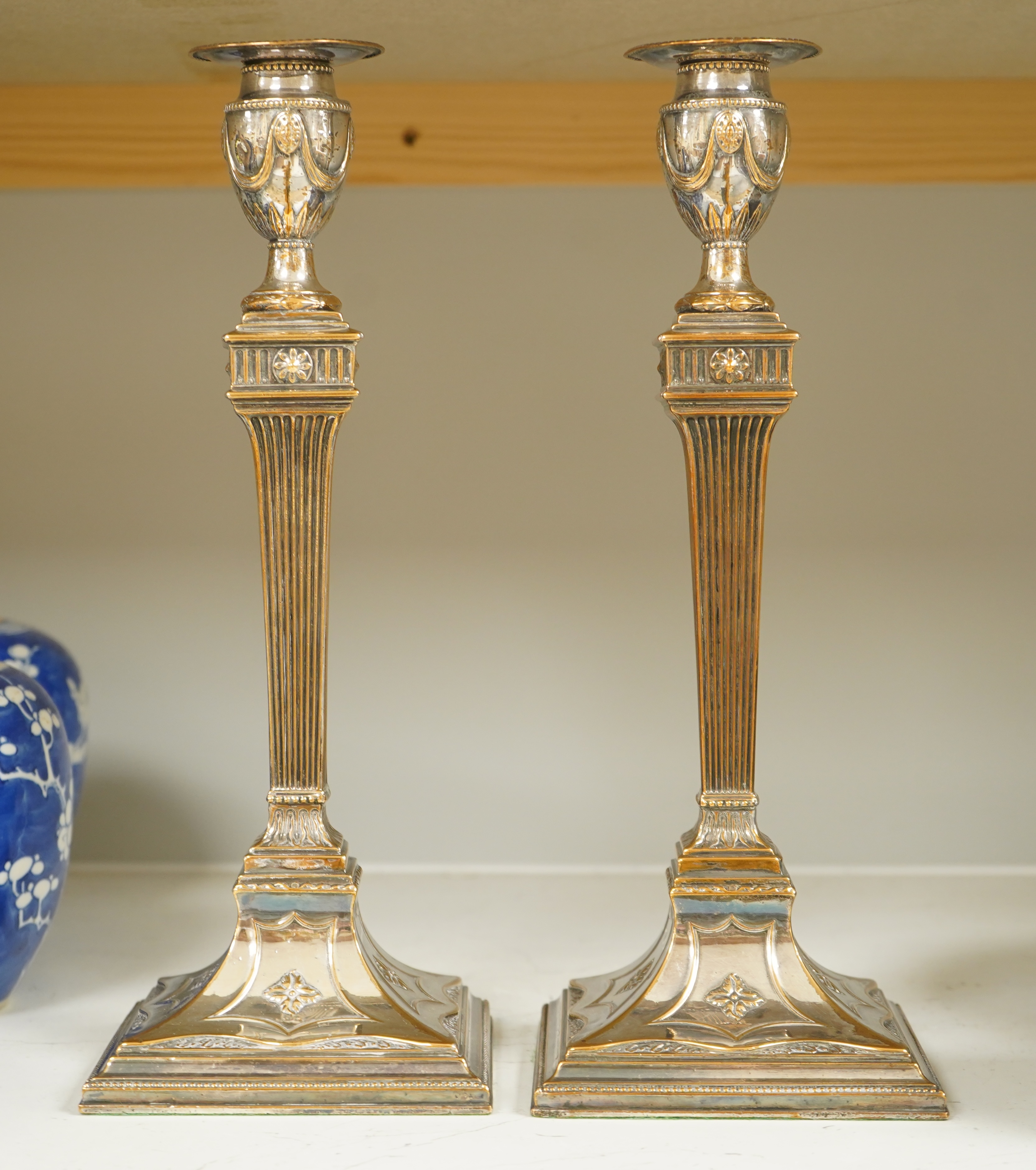 A pair of Adam design silver plated candlesticks, 31.5cm. Condition - worn otherwise good